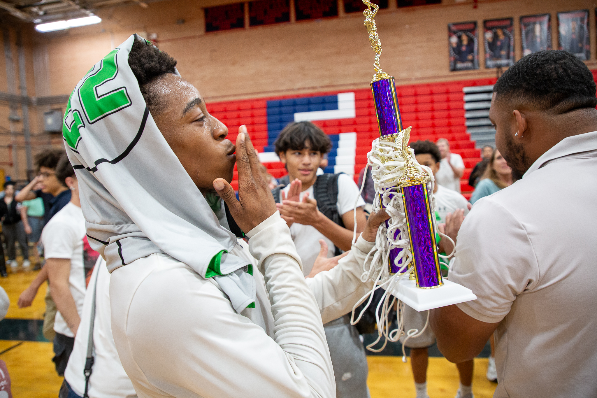 A Gridley player blows a kiss at the team's trophy after the game