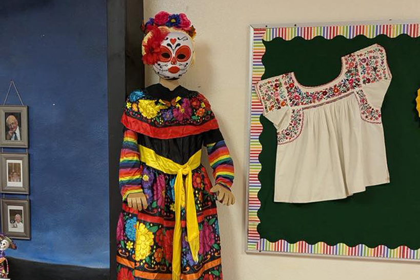 A figurine in traditional Dia de los Muertos dress