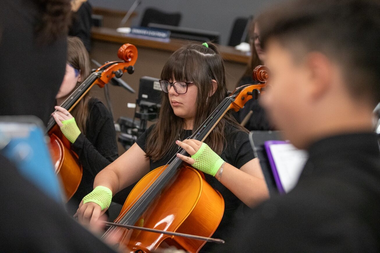 Gridley students play cello at the Governing Board meeting