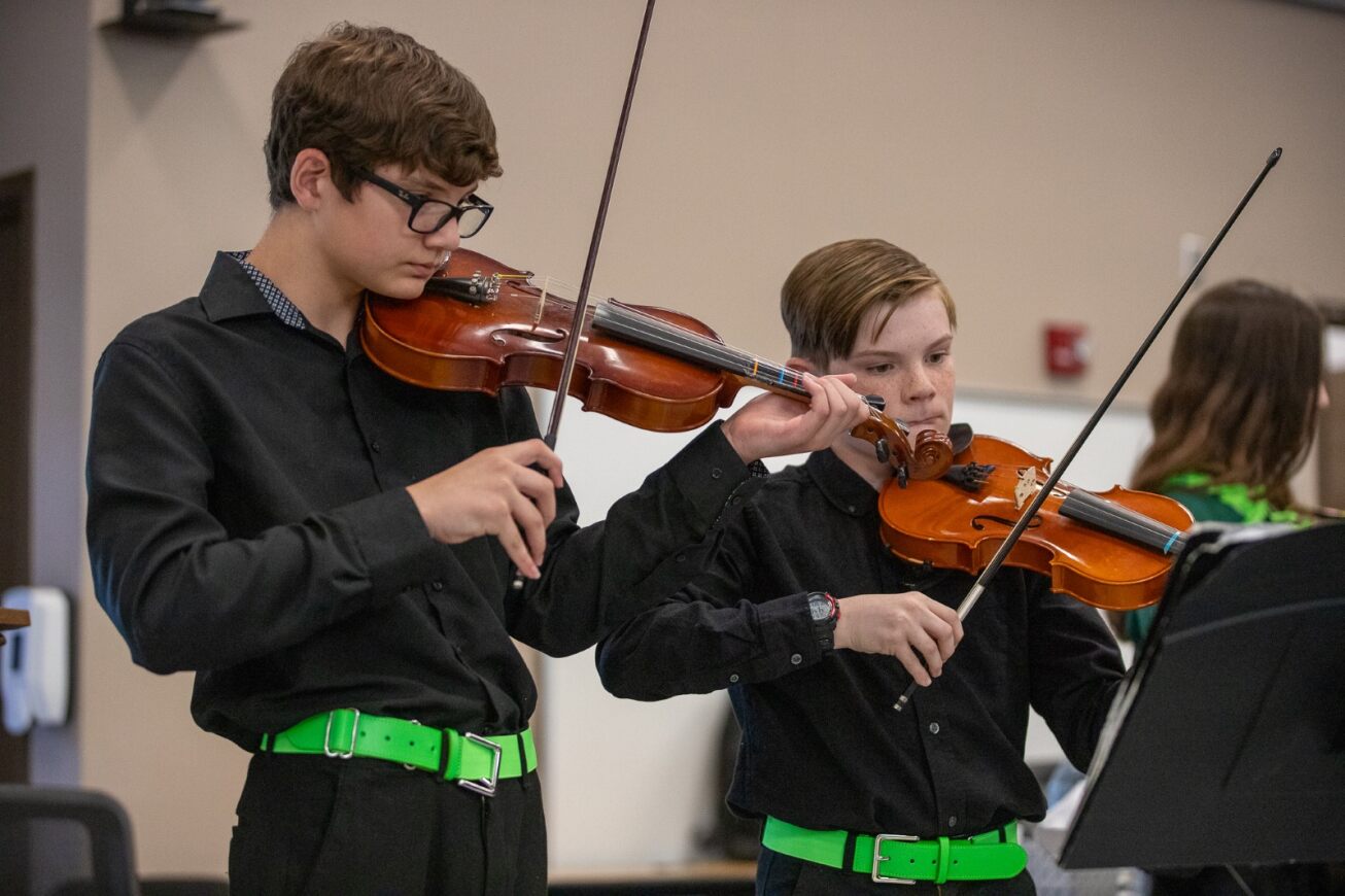 Two Gridley students play violin at the Governing Board meeting